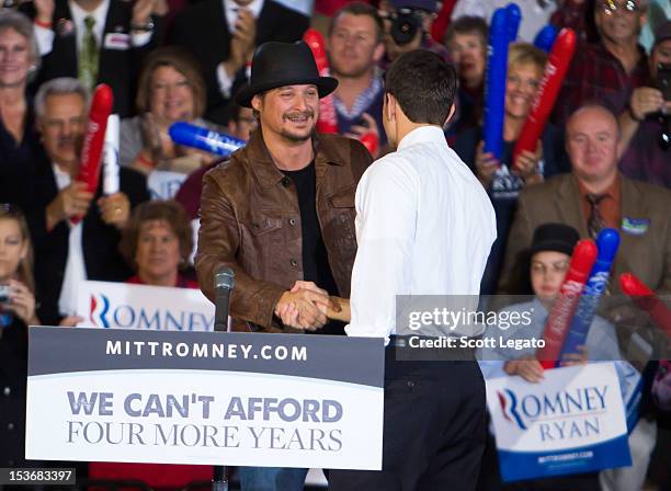 Kid Rock and Congressman Paul Ryan attends the Congressman Paul Ryan Rally With Kid Rock at Oakland University Athletic Center on October 8, 2012 in...