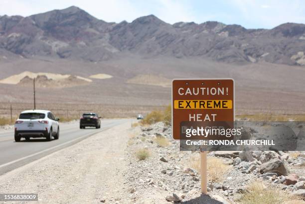 Heat advisory sign is shown along US highway 190 during a heat wave in Death Valley National Park in Death Valley, California, on July 16, 2023. Tens...