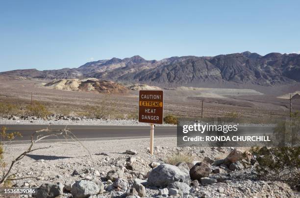 Heat advisory sign is shown along US highway 190 during a heat wave in Death Valley National Park in Death Valley, California, on July 16, 2023. Tens...