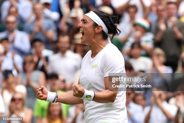 Ons Jabeur of Tunisia celebrates victory against Elena Rybakina of Kazakhstan in the Women's Singles Quarter Final match during day ten of The...