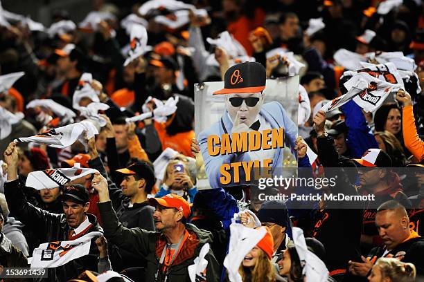 Baltimore Orioles fans cheer during Game Two of the American League Division Series against the New York Yankees at Oriole Park at Camden Yards on...