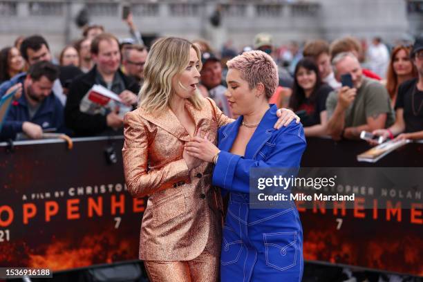 Emily Blunt and Florence Pugh attend a photocall for "Oppenheimer" at Trafalgar Square on July 12, 2023 in London, England.