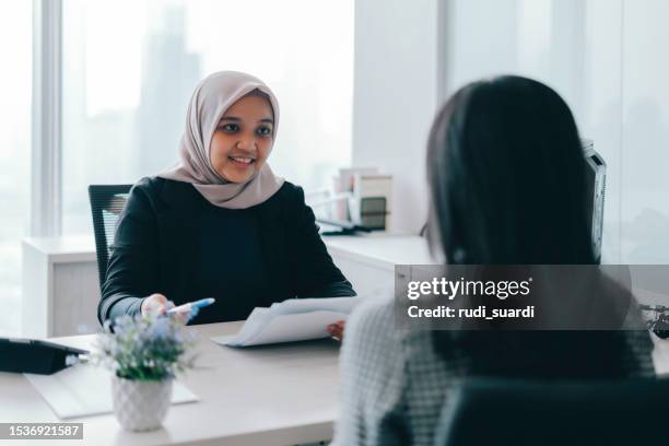 business woman in a job interview - job interview table stock pictures, royalty-free photos & images