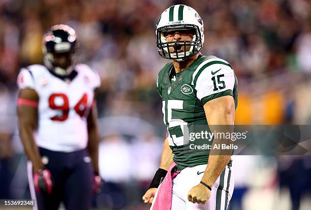 Tim Tebow of the New York Jets reaxcts after he ran for a first down in the secon dhalf against the Houston Texans at MetLife Stadium on October 8,...