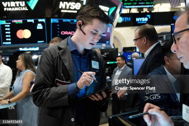 Traders work on the floor of the New York Stock Exchange on July 12, 2023 in New York City. New government data released Wednesday showed that...