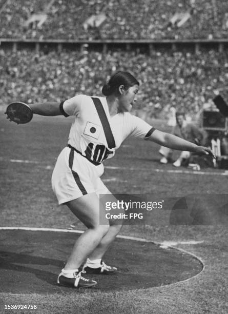 Japanese athlete Fumi Kojima competes in the women's discus throw at the 1936 Summer Olympics, held at the Olympiastadion in Berlin, Germany, 4th...