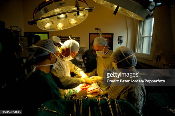 Surgeon Chris Rudge and his team carry out a kidney transplant operation on a patient in an operating theatre at St Peter's NHS Hospital in Chertsey,...