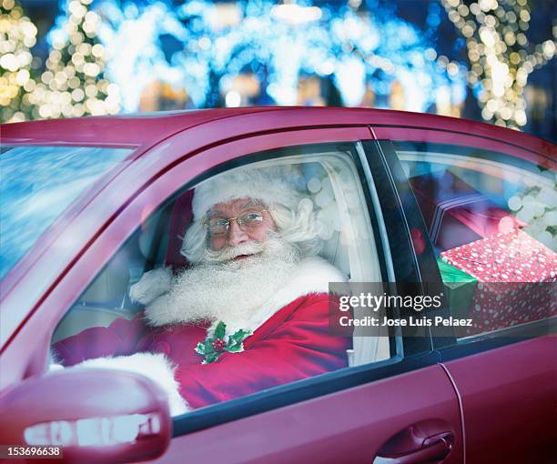 santa claus driving a car full of presents - xmas car stock pictures, royalty-free photos & images