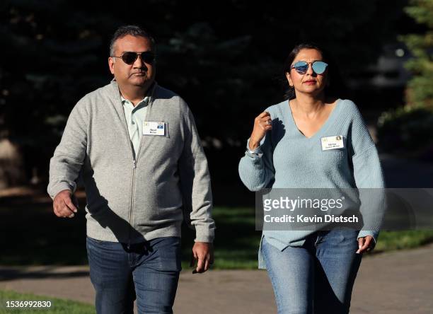 Neal Mohan, CEO of YouTube, and his wife Hema Sareen Mohan walk to a morning session at the Allen & Company Sun Valley Conference on July 12, 2023 in...