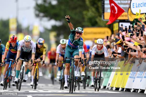 Jasper Philipsen of Belgium and Team Alpecin-Deceuninck - Green Points Jersey celebrates at finish line as stage winner ahead of Phil Bauhaus of...