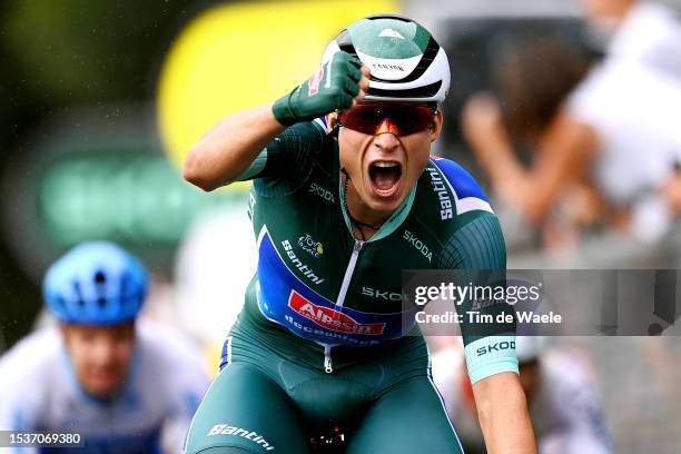 Jasper Philipsen of Belgium and Team Alpecin-Deceuninck - Green Points Jersey celebrates at finish line as stage winner during the stage eleven of...