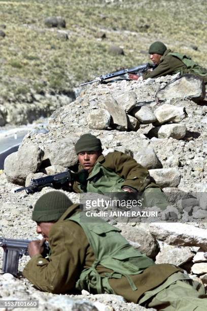 Peruvian army soldiers guard in the international highway Moquegua, Peru-La Paz, Bolivia, near Santa Rosa, some 1600kms southeast of Lima, 30 October...