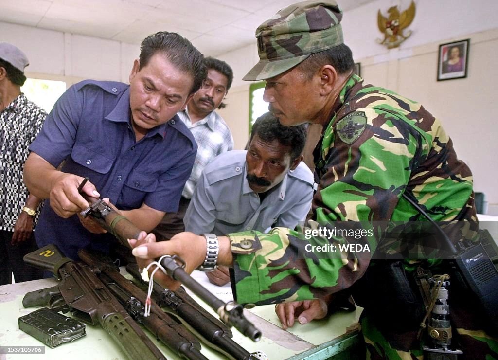 Weapon Check In An Indonesian soldier checks a rifle shortly after it had been... News ...