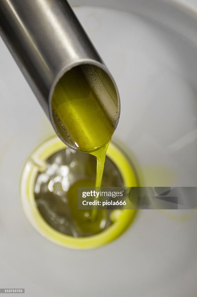 Olive Oil Pouring from Olives Pressing