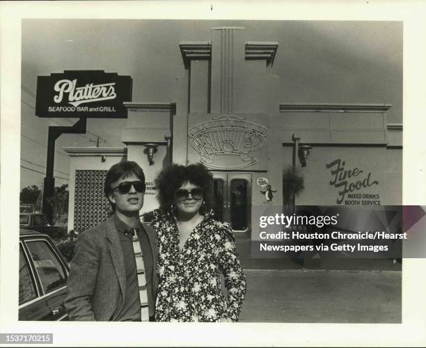 Bill and Patricia Beatty stand in front of Platters, their most recent creation of tacky, comfortable designs to make customers happy. Platters was...