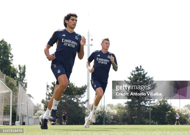 Jesús Vallejo and Toni Kroos players of Real Madrid are training at Valdebebas training ground on July 12, 2023 in Madrid, Spain.