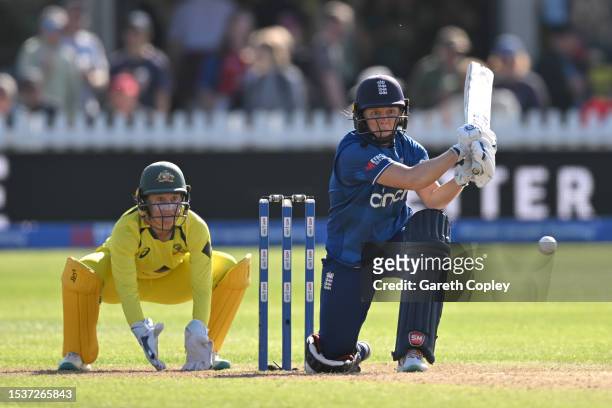 Heather Knight of England bats watched by Australia wicketkeeper Alyssa Healy during the Women's Ashes 1st We Got Game ODI match between England and...