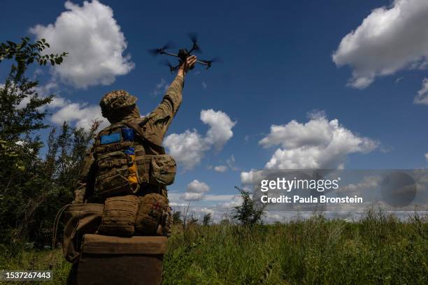 Ukrainian drone operator named Chaynik from the 3rd Assault brigade lands his drone after a surveillance flight on July 16, 2023 near Bakhmut in the...