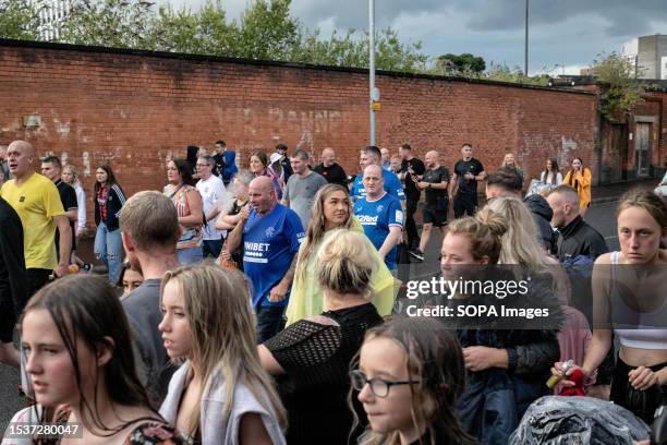 Locals flock through the streets after a drum and flute band initiated a march which will proceed through the labyrinthine alleys and estates of...