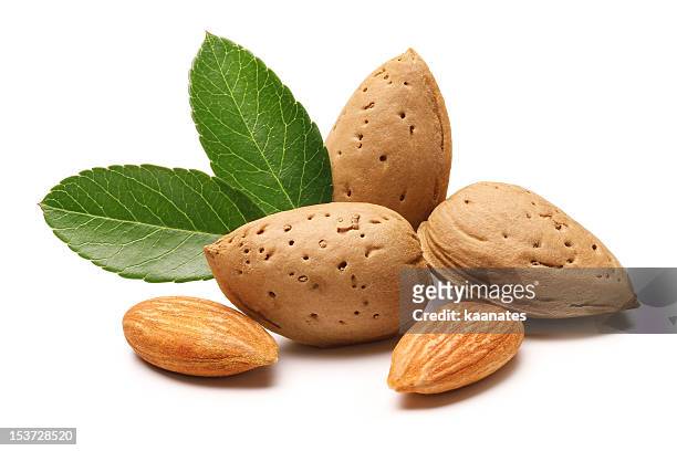 almonds - almonds isolated stock pictures, royalty-free photos & images