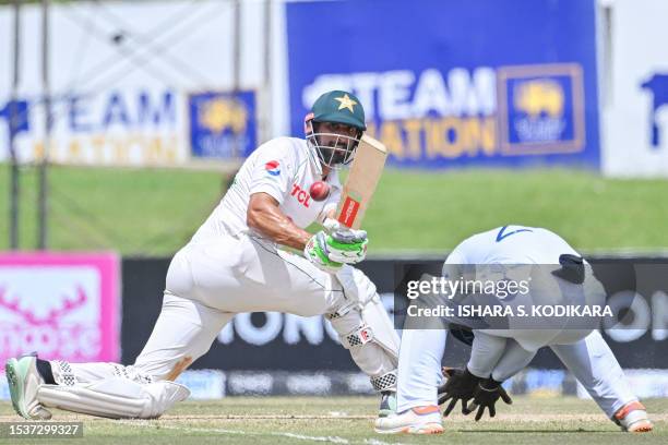 Pakistan's Shan Masood plays a shot during the second day of the first cricket Test match between Sri Lanka and Pakistan at the Galle International...