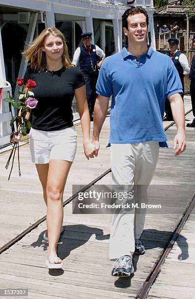 Alex Michel and Amanda Marsh from the television reality show "The Bachelor" tour Disneyland on their date April 29, 2002 in Anaheim, CA.