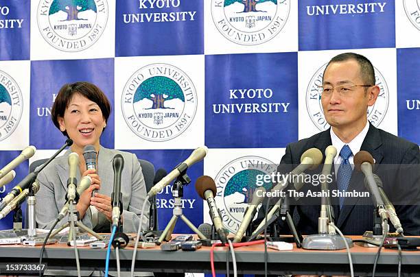 Kyoto University Professor Shinya Yamanaka smiles as his wife Chika speaks during a press conference at Kyoto University on October 9, 2012 in Kyoto,...