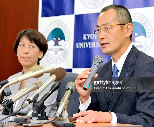 Kyoto University Professor Shinya Yamanaka speaks while his wife Chika smiles during a press conference at Kyoto University on October 9, 2012 in...