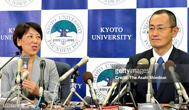 Kyoto University Professor Shinya Yamanaka listens to his wife Chika speaking during a press conference at Kyoto University on October 9, 2012 in...