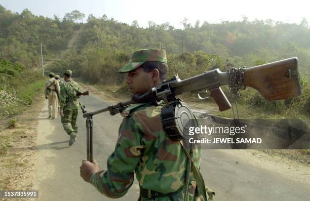 Bangladeshi Army members patrol the hill-area of country's southern district of Rangamati 20 February 2001 where Torben Mikkelsen and Nils Hulgaard...