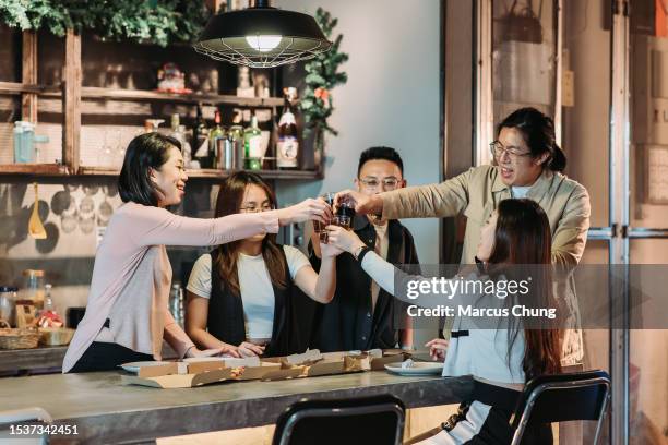 asian chinese group of people toasting with glass of drink at office pantry - voorraadkast stockfoto's en -beelden