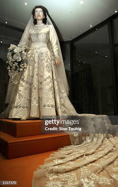 Mannequin of Britain's Queen Elizabeth II wears her wedding dress April 30, 2002 at the launch of the exhibition "A Century of Queens'' Wedding...