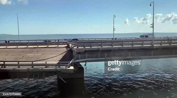 This video grab taken from a rimea24TV footage on July 17, 2023 shows the damaged Kerch bridge -- linking Crimea to Russia -- which was heavily...