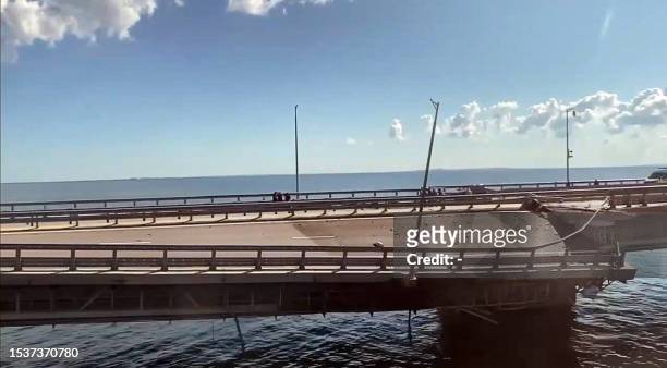 This video grab taken from a rimea24TV footage on July 17, 2023 shows the damaged Kerch bridge -- linking Crimea to Russia -- which was heavily...