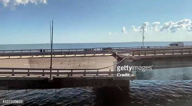 This video grab taken from a rimea24TV footage on July 17, 2023 shows the damaged Kerch bridge -- linking Crimea to Russia -- which was heavily...