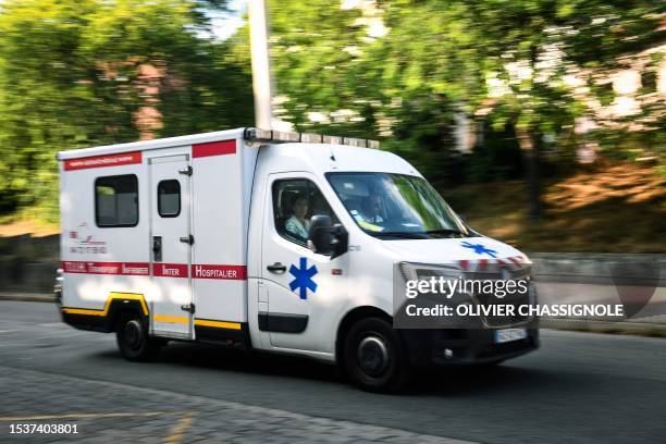 An ambulance drives down the street in Lyon, eastern France, on July 16, 2023.