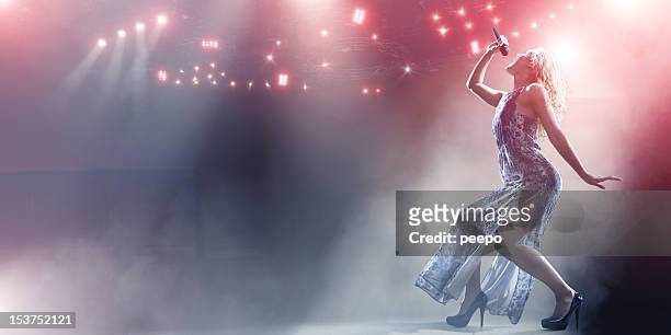 singer's powerful stage performance - dry ice stock pictures, royalty-free photos & images