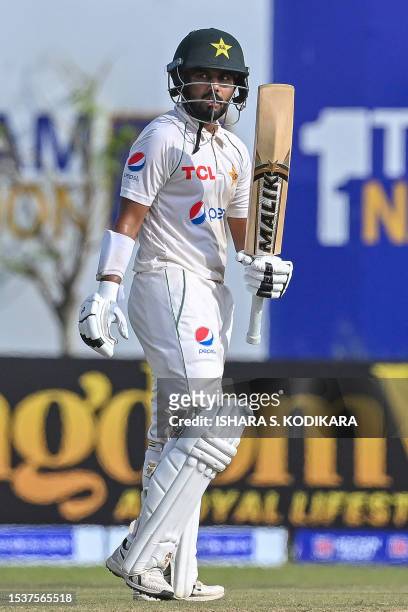 Pakistan's Saud Shakeel celebrates after scoring a half-century during the second day of the first cricket Test match between Sri Lanka and Pakistan...