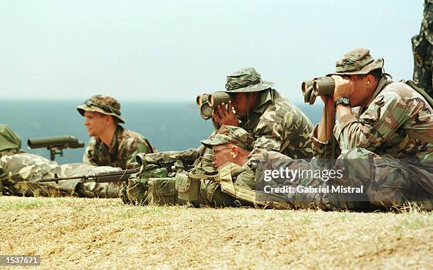 Marines instruct Philippine soldiers on how to use a sniper rifle on the first day of a two-week military exercise with the Philippine military April...