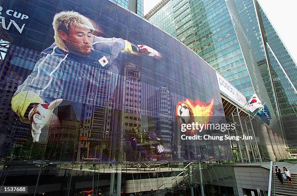 Giant illustration of South Korean goal keeper Kim Byung-Ki is displayed April 24, 2002 on the wall of the headquarters of steel giant Pohang Iron...
