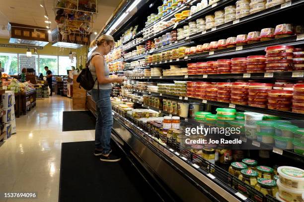 Shopper makes their way through a grocery store on July 12, 2023 in Miami, Florida. The U.S. Consumer price index report showed that inflation fell...