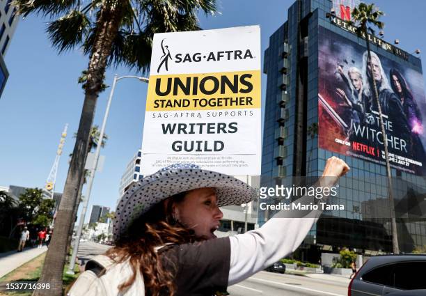 Member Christine Robert pickets in solidarity with striking WGA workers outside Netflix offices on July 12, 2023 in Los Angeles, California. Members...