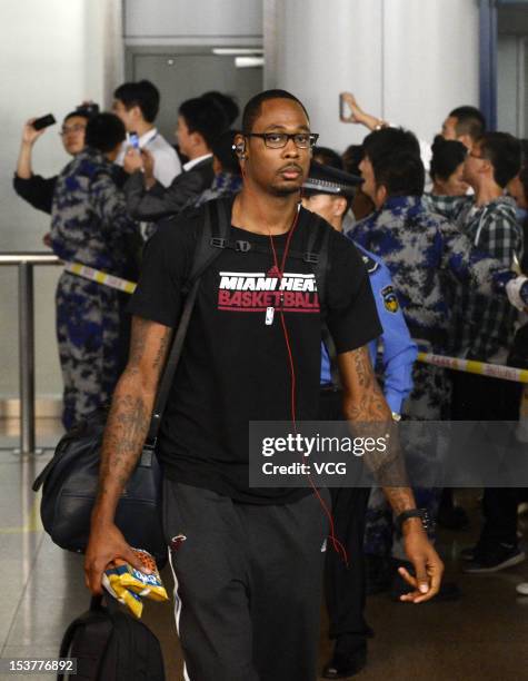 Mickell Gladness of the Miami Heat arrives at Beijing Capital International Airport before the first leg of the 2012 NBA China games on October 8,...