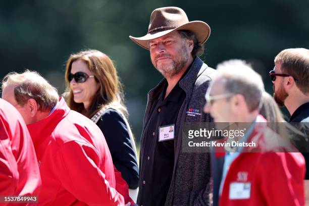 Marc Benioff, Chief Executive Officer of Salesforce, walks with other attendees as they leave a morning session at the Allen & Company Sun Valley...