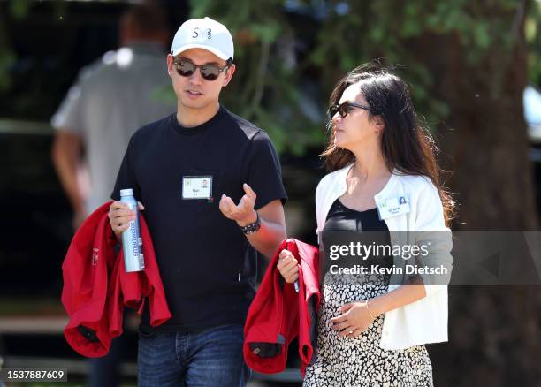 Nan Li, co-founders and Managing Partners at Dimension Capital, and Grace Chou leave a morning session at the Allen & Company Sun Valley Conference...