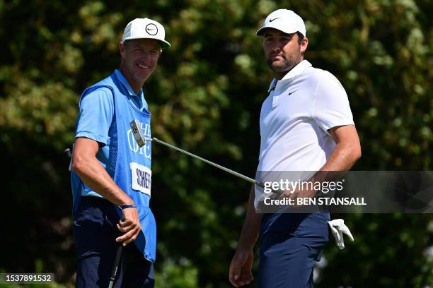 Golfer Scottie Scheffler talks to his caddie on the 4th green during a practice round for 151st British Open Golf Championship at Royal Liverpool...