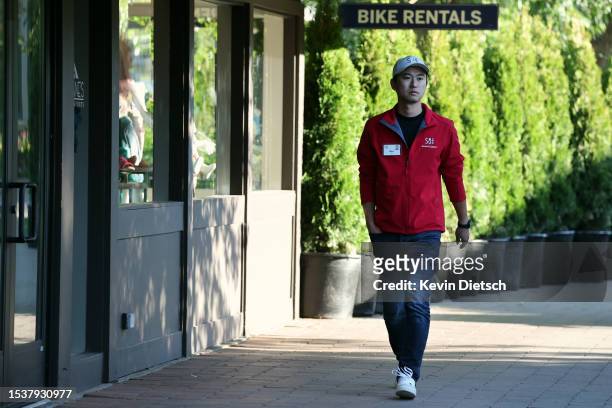Nan Li, co-founders and Managing Partners at Dimension Capital, walks to a morning session at the Allen & Company Sun Valley Conference on July 12,...
