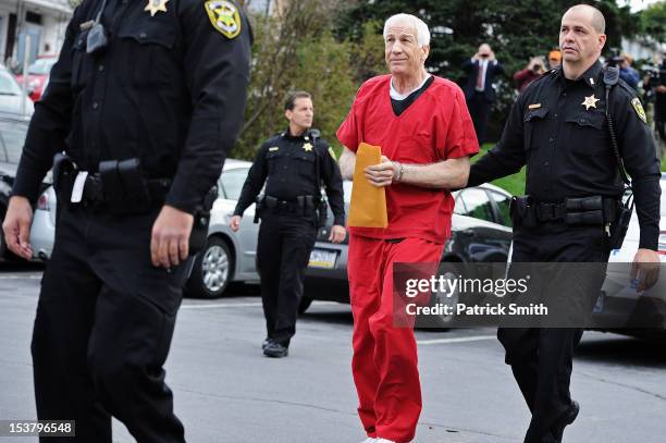 Former Penn State assistant football coach Jerry Sandusky walks into the Centre County Courthouse before being sentenced in his child sex abuse case...