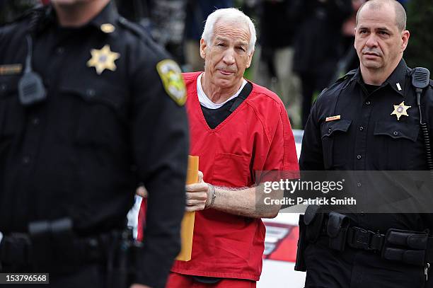 Former Penn State assistant football coach Jerry Sandusky walks into the Centre County Courthouse before being sentenced in his child sex abuse case...