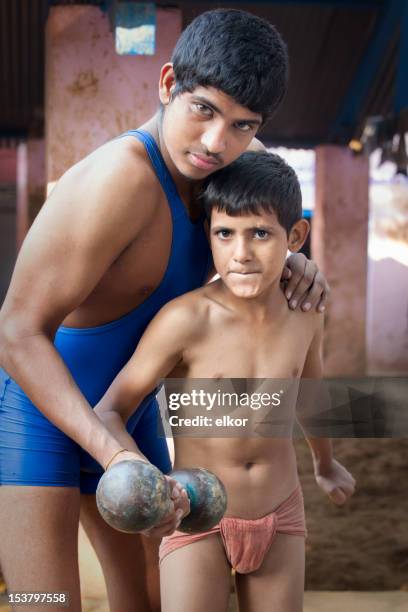 indian wrestler boys holding dumbbells together - wrestling team stock pictures, royalty-free photos & images